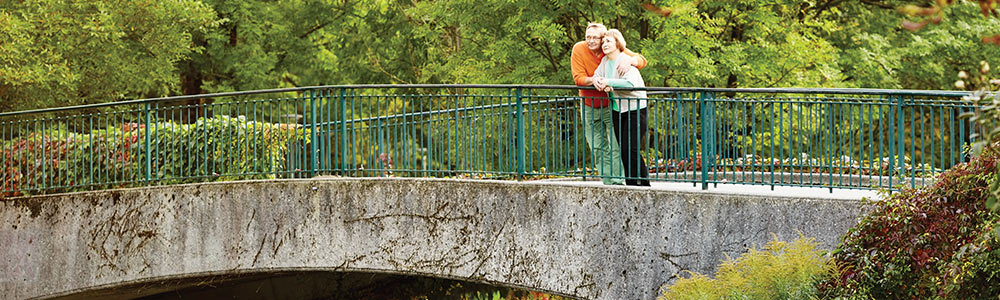 couple standing on bridge together enjoying the view fixed index annuities explained roseville ca