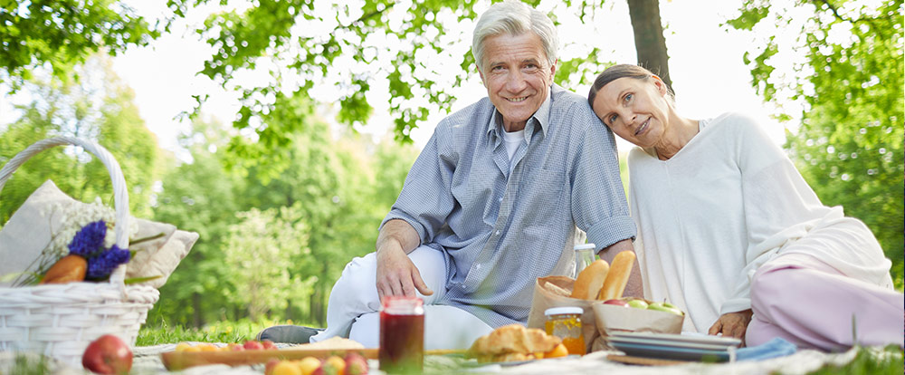 senior couple having picnic in the park life insurance for retirement roseville ca