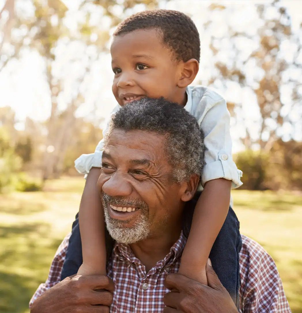grandson on his grandfathers shoulders guaranteed income