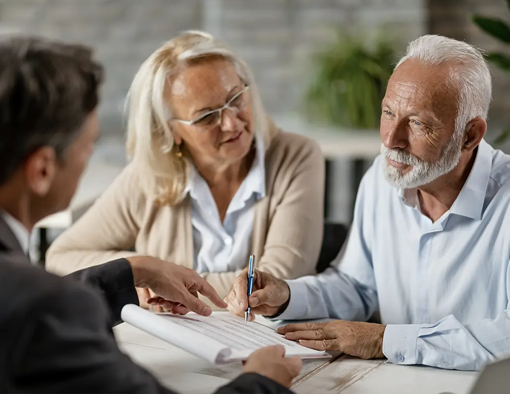 retirees meeting with financial advisor to discuss a simple retirement plan